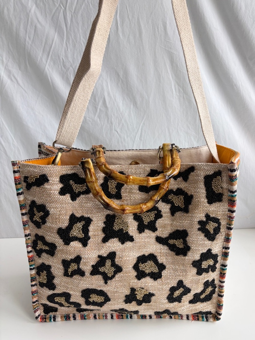 America & Beyond Luxe Leopard Tote Bag
Beaded Bamboo Handles Beige/Black/Orange - Picture 8 of 17